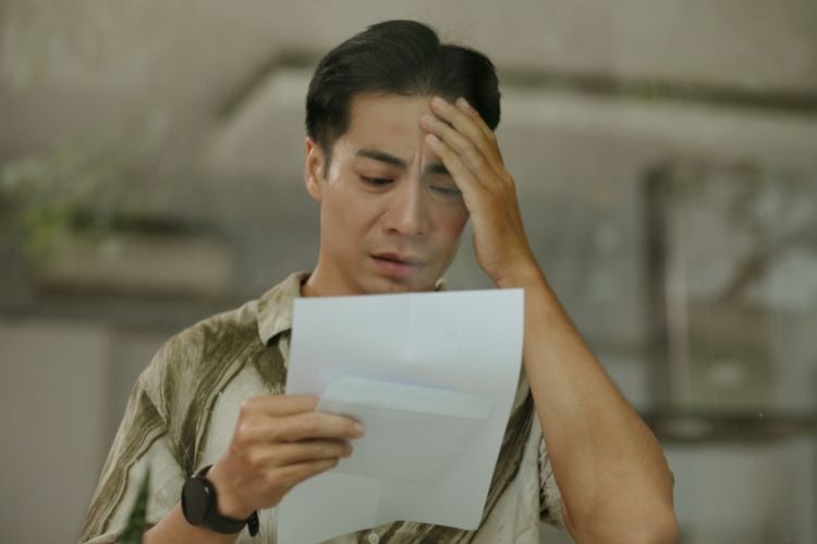 A man experiencing financial stress